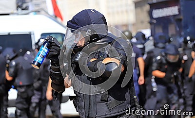 Sofia, Bulgaria on September 2, 2020: Heavily armed police officers holding spraying tear gas bottle Editorial Stock Photo