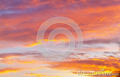 Soft, airy sky in the evening with feathery clouds in orange and blue shades Stock Photo