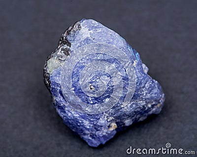 Soft blue violet rough TANZANITE from Tanzania isolated on black Stock Photo