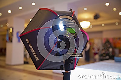 Soft-box Diffuser for Speed-light Speed-lite Quantum Flash . The birthday uses a soft-box for shooting Editorial Stock Photo