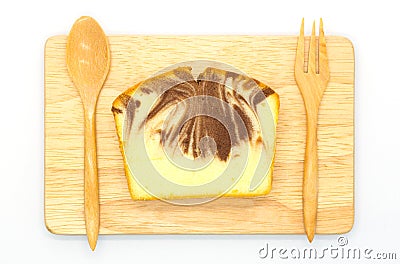 Soft butter cake on wooden plate, top view Stock Photo