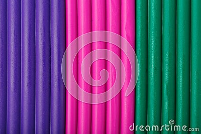 Soft clay from briquettes of violet, magenta and green for modeling. Plastic colorful material for children art education Stock Photo