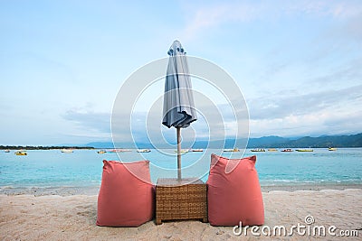 Soft colorful lounge chairs on the empty beach of Trawangan island, Indonesia Stock Photo