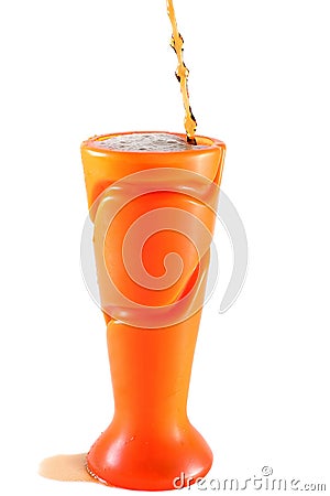 Soft drink or juice spilling out of a plastic vase Stock Photo