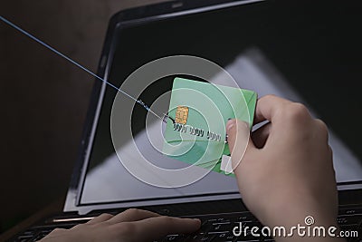 soft focus, bank card, hook. the child pays for the purchase using the card. scammers are trying to steal money from the card Stock Photo