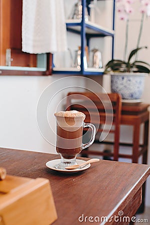 Soft focus on cappuccino coffee cup, coffee for background - vintage effect process picture. Cappuccino in big glass Stock Photo