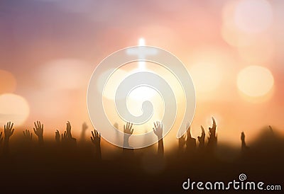 soft focus of Christian worship with raised hand on white cross background Stock Photo