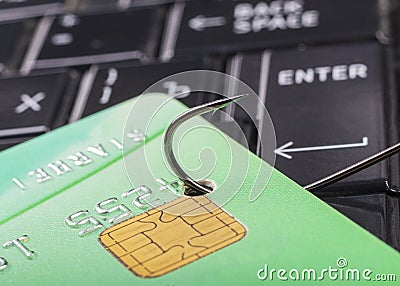 soft focus. close-up. bank card. the keyboard is black. a fishing hook. concept. stealing money on the Internet Stock Photo
