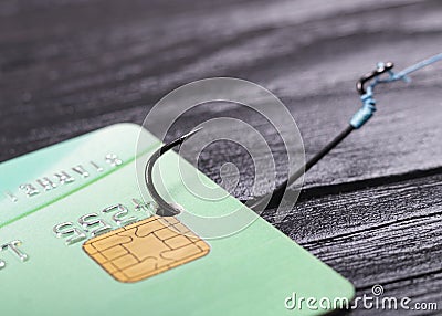 soft focus. close-up. bank card. the keyboard is black. a fishing hook. concept. stealing money on the Internet Editorial Stock Photo