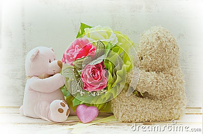Soft focus couple of cute bears holding roses bouquet Stock Photo