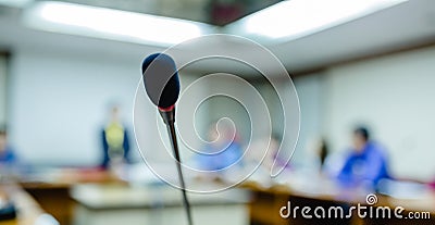Soft focus of desktop wireless Conference microphones with blurry business group in a meeting room, microphone on the desk in Stock Photo
