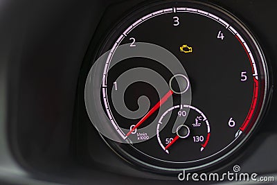 soft focus. natural light. the dashboard. the indicator is lit, the engine error is a check. there is a tinting Stock Photo