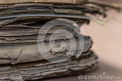 Soft focus of a pile of old tattered papers with an illegible signature Stock Photo