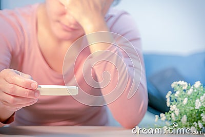 Soft focus on sad women hand hold the pregnant test pad after saw the negative test result Stock Photo