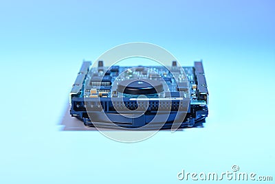 Soft focus. Used hard disk isolated on white background and blue backlight. Dusty old hdd Stock Photo