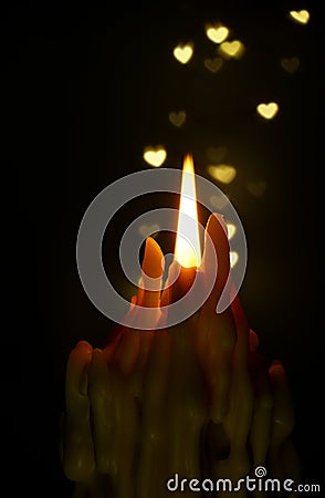 Soft focus valentine hearts shapes with candle foreground Stock Photo
