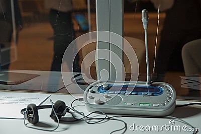 Soft focus of wireless Conference microphones and notebook in a meeting room. translators cubicle . interpreting - Microphone and Editorial Stock Photo