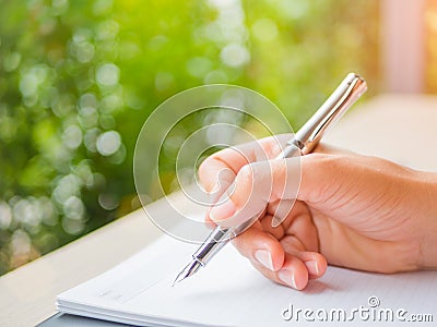 Soft focus woman hand writing, business document and note book Stock Photo