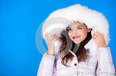 Soft fur. Winter season. Woman wear down jacket with furry hood. Style code with elegance. For those wishing stay modern Stock Photo