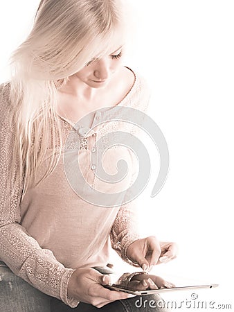 Soft image of young woman using an iPad Stock Photo