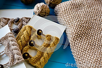 Soft knitted blanket, yarn balls lying on background Stock Photo