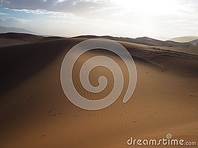 Soft natural rusty red sand dune and bright sky of vast desert landscape copyspace background with hot sunlight, Sossus Stock Photo