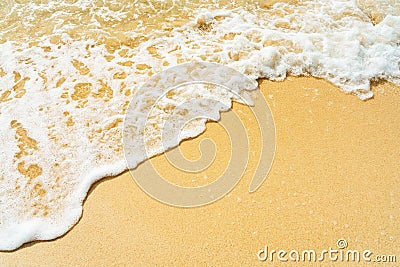Soft ocean wave on clean sandy beach Stock Photo