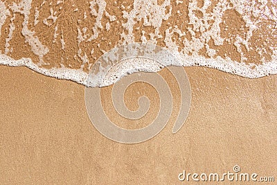 Soft ocean wave on clean sandy beach. Summer Holiday background, beautiful sand beach with turquoise tropical sea water. Stock Photo