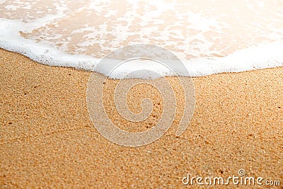 Soft ocean wave on sandy beach Stock Photo