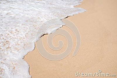 Soft ocean wave on tropical sandy beach in summer background with copy space Stock Photo
