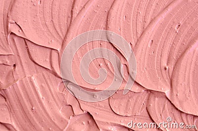 Soft pink cosmetic clay facial mask, cream texture close up, selective focus. Abstract background with brush strokes. Stock Photo