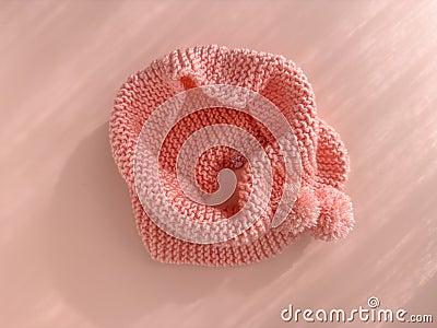 Soft pink lace knitted round scarf isolated on pastel pink background. Fashion children's accessory Stock Photo