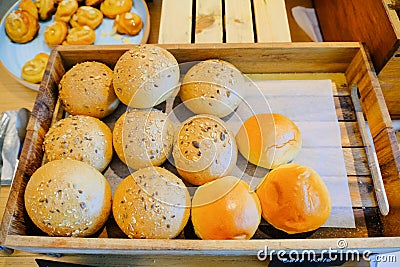 soft rools baked bread in wooden tray Stock Photo