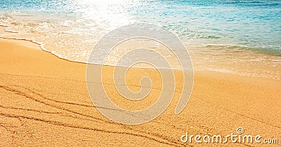 Soft sand beach by the sea with crystal clear water of a tropical island Stock Photo