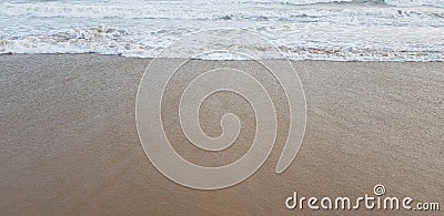 soft sea waves on textured sandy surface Stock Photo