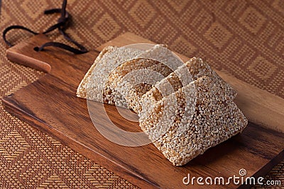 Soft sesame snacks. Roasted sesame seeds bar in sweet honey or caramel Stock Photo