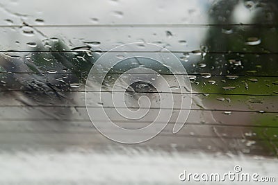 Soft shot of Drops Of Rain On car Glass Background Stock Photo