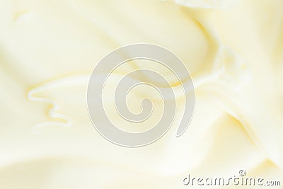 Soft Silky Creamy Butter Texture with Beautiful Swirls. Pastel Light Yellow Color. Food Poster Background Stock Photo