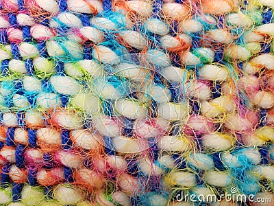 Soft and stringy multicolored woven yarn, perfect for bright backgrounds. Stock Photo