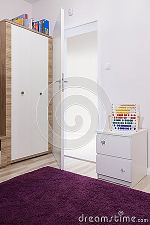 Soft violet carpet in child's room Stock Photo