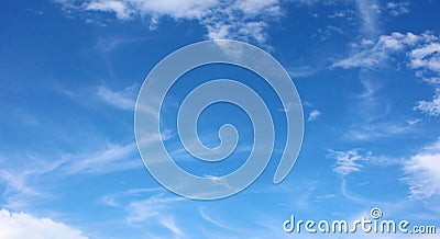 Soft white clouds against blue sky Stock Photo