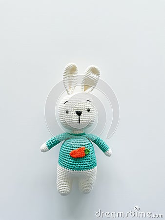 Soft white crochet bunny. on a white background. Stock Photo