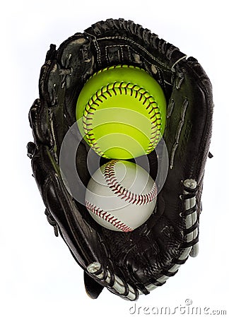 Softball and baseball in a glove Stock Photo