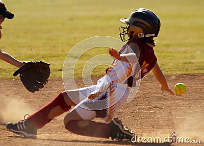 Softball player sliding Stock Photo