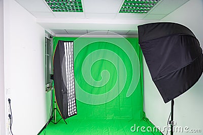 Softbox and strip light in a photostudio with green screen Stock Photo