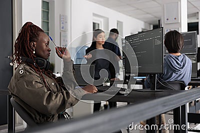 Software developer thinking at it ideas trying to write code and create new interface Editorial Stock Photo