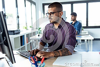 Software developer working with computer in the modern startup office Stock Photo