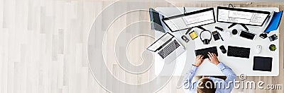 Developer Working On Multiple Computer Screens Stock Photo