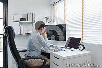 Software development concept, Male programmer read data code to thoughtful about developing website Stock Photo