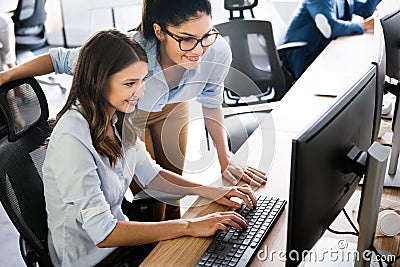 Software engineers working on project and programming in company Stock Photo